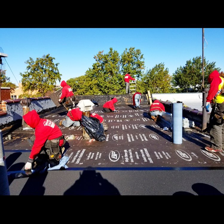 Gutters Staff on NYC Roof