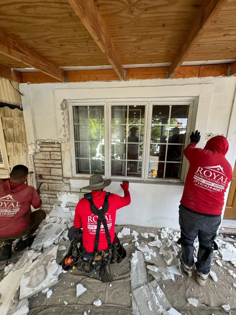 Royal Roofers Applying Siding in Queens, NY
