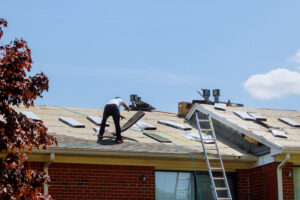 Residential roof replacement featuring new asphalt shingle installation.