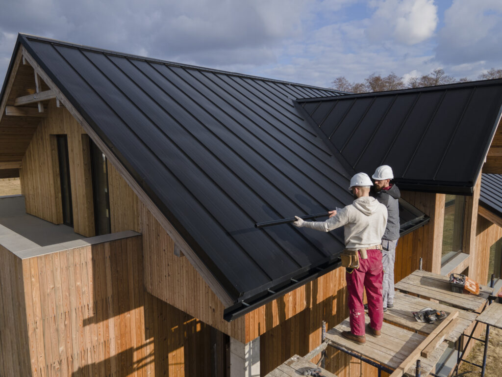 Professional roofing team performing a full roof replacement in NYC.