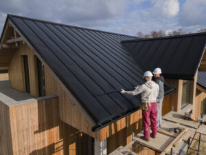 Professional roofing team performing a full roof replacement in NYC.